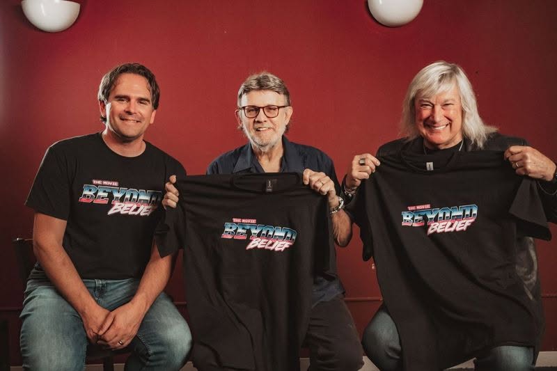 Petra members holding Beyond Belief t-shirts